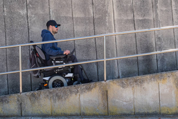 istock Man on a wheelchair on ramp. 1404061415