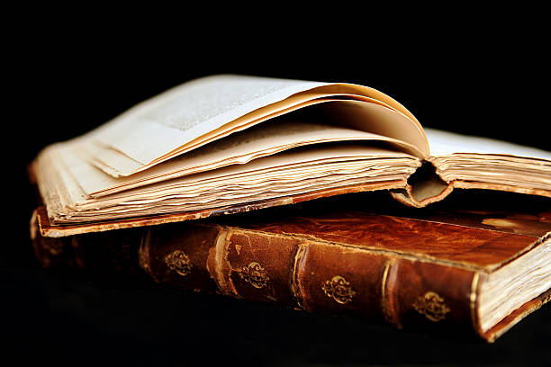 istock Weathered and worn set of books with brown covers 140406297