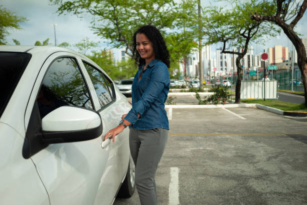 istock Woman opening car 1404063435