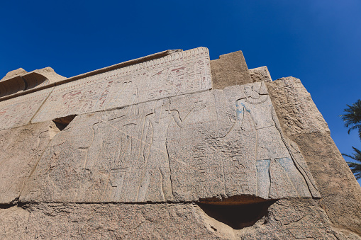 View to an Ancient Egyptian Hieroglyphic Drawing on the wall of the Karnak Temple Complex near Luxor, Egypt