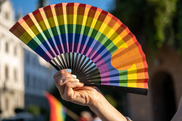 istock Hand fan in Pride colors. 1404064149