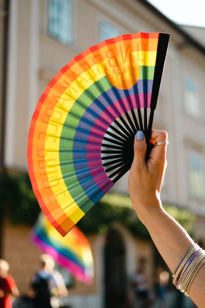 istock Hand fan in Pride colors. 1404064153