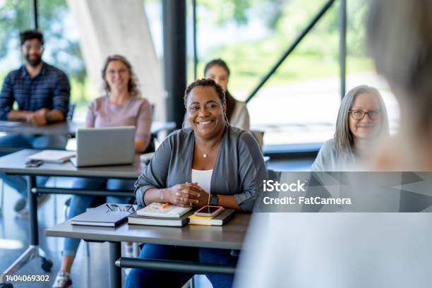 Mature Students Listening In Class Stock Photo - Download Image Now - Lecture Hall, Adult Student, Adult