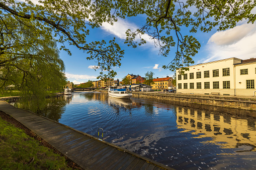 Sweden. Uppsala. 05.14.2022. Beautiful view of tourist excursion boat on cityscape background.