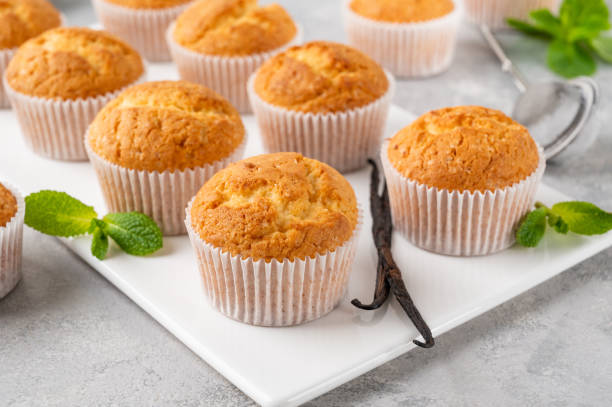 istock Fresh baked Vanilla cupcakes with mint, selective focus, copy space. 1404071691
