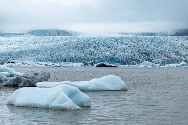 Small icebergs in the Fjallsarlon glacier lagoon in southern Iceland stock photo