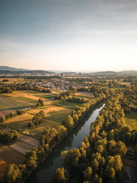istock River, Green Nature and City in the Back 1404073000
