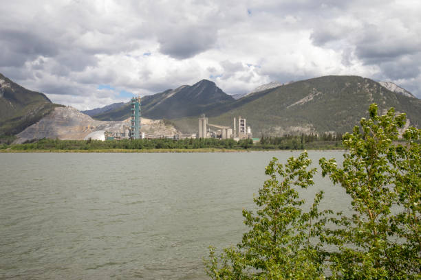 istock View of cement  plant in mountain setting, lake in foreground 1404074042