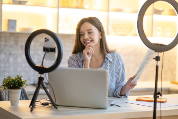 istock Woman with document thinking looking at laptop 1404076842