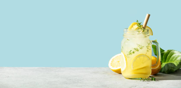 Banner. Summer drink with lemon and rosemary close up, copy space stock photo