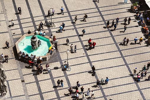 A high angle view of a busy pedestrian crossing Marienplatz, Munich, Germany