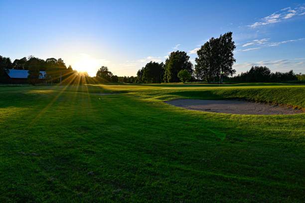 istock evening light over golf course in Kumla Sweden 1404078930