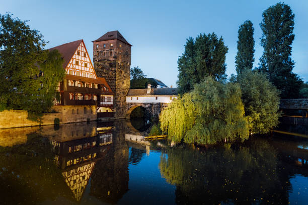 Nuremberg old city houses on riverside of Pegnitz river from Maxbrucke (Max bridge)Nuremberg, Franconia, Bavaria, GermanyThe Weinstadel, built in the 15th century
