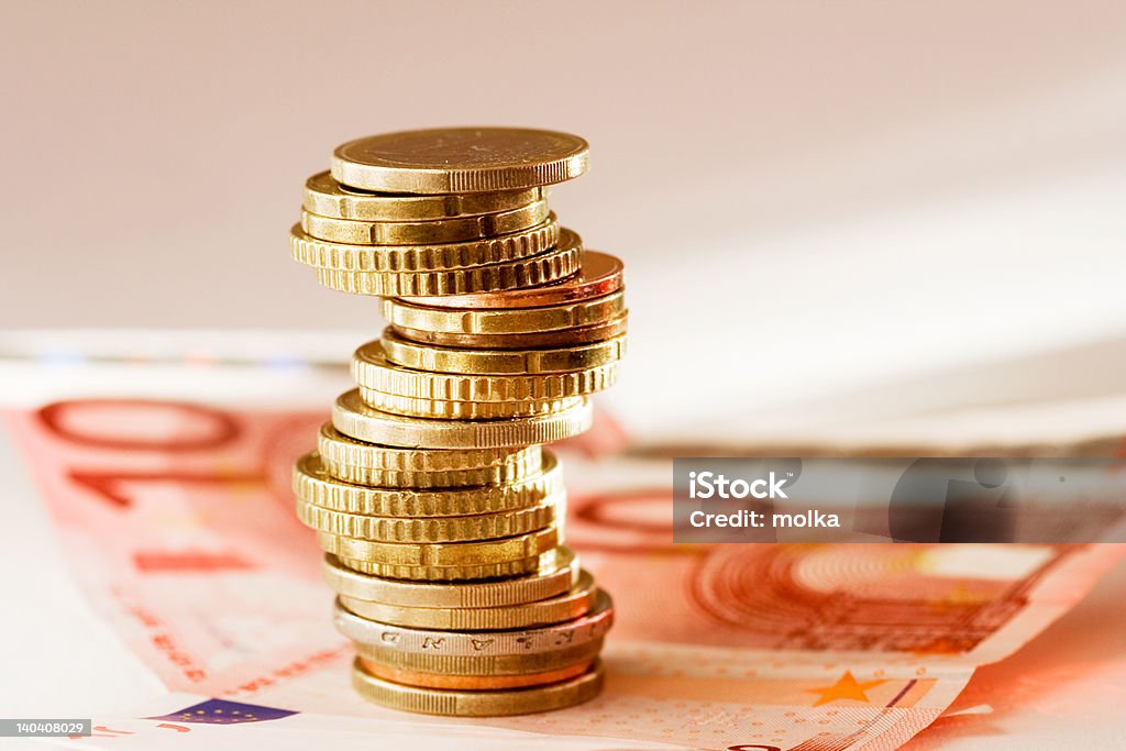 Euro money Stack of coins and ten euro paper bill Coin Stock Photo