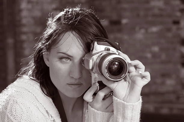 istock Girl with SLR photo camera 140408129