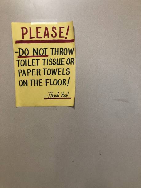 istock Sign in bathroom. Do not throw garbage on floor. 1404081857