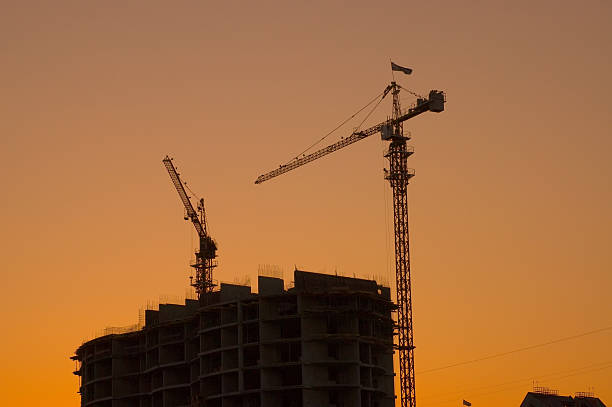 istock House building crane silhouettes 140408566
