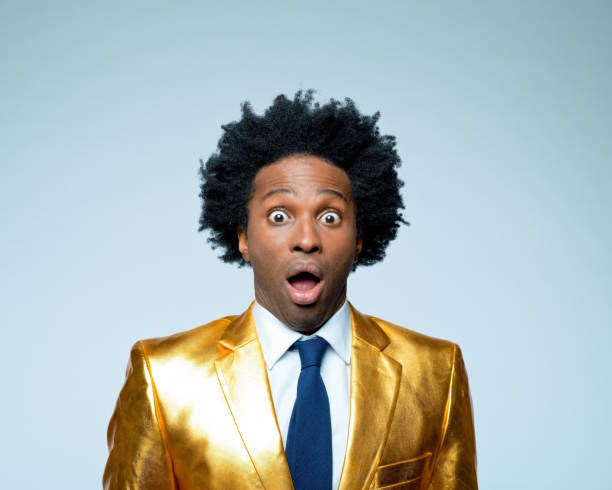 istock Surprised businessman in golden blazer 1404088173