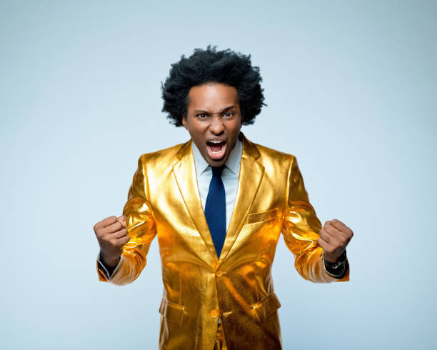 istock Successful man clenching fists and screaming 1404088205