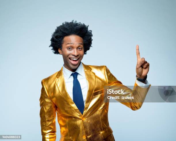 Man Laughing And Pointing In Golden Suit Stock Photo - Download Image Now - Gold Colored, 30-34 Years, Adult