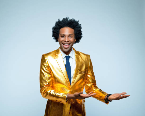 istock Happy man in golden suit gesturing 1404089488