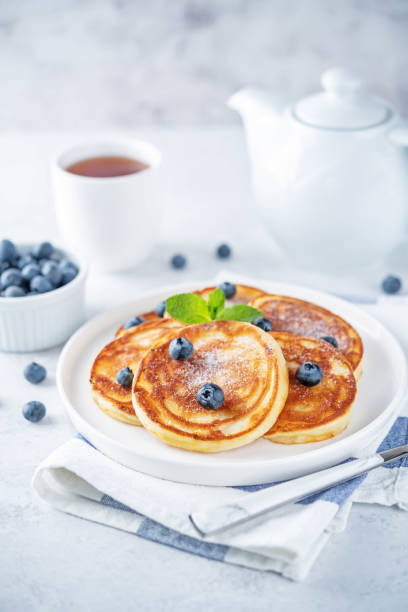 istock Ricotta pancakes with fresh blueberries in a plate 1404089516