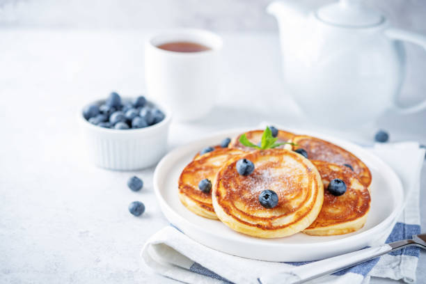 istock Ricotta pancakes with fresh blueberries in a plate 1404089525