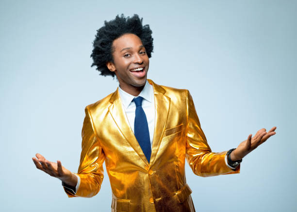 istock Happy man in golden blazer gesturing 1404090202