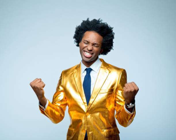 istock Happy businessman clenching fists 1404090495