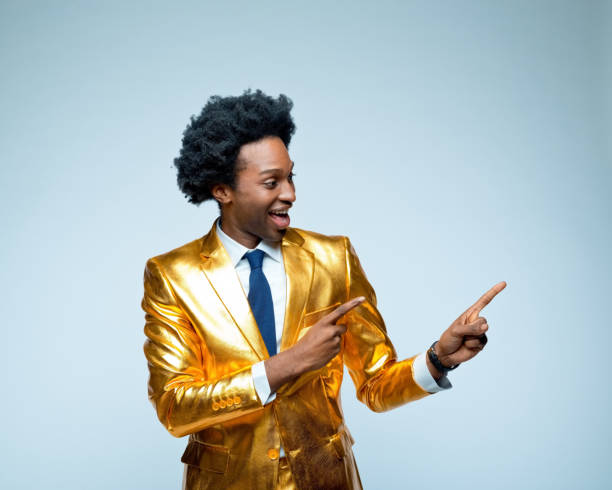 istock Businessman in golden suit gesturing 1404091695