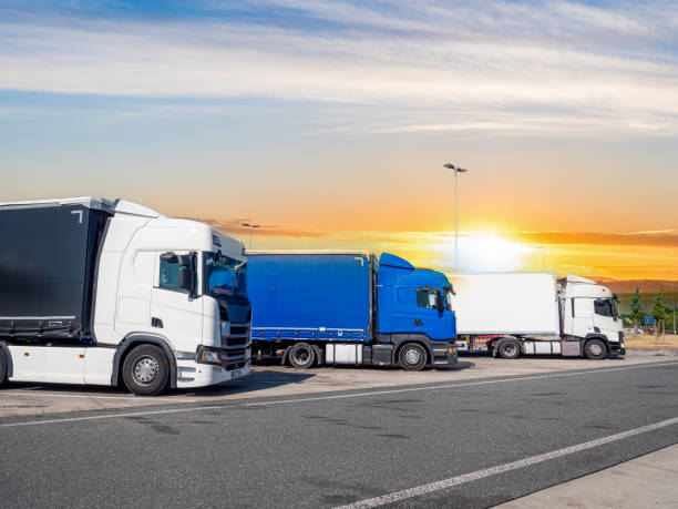istock trucks at a rest area in the sunset 1404092963