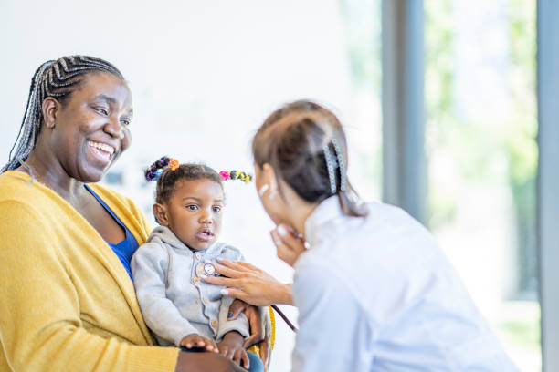 istock Mother with Her Daughter at the Doctors 1404092982