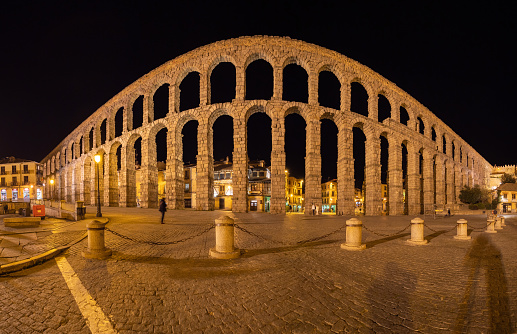 The aqueduct in Segovia, Spain, was built during the Roman Empire. The aqueduct is built with perfectly carved granite blocks without any type of mortar. The date of construction of the Aqueduct of Segovia in the second century of our era.