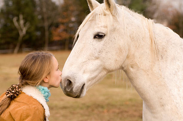 istock Girl kissing white horse 140409400