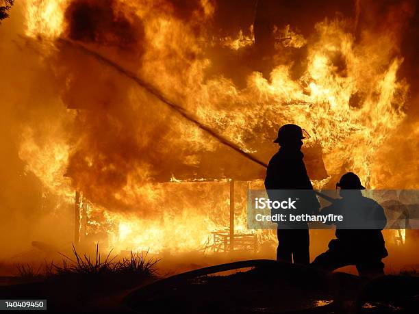 Firefighters Hose Down House Stock Photo - Download Image Now - Firefighter, Fire Station, Emergency Equipment