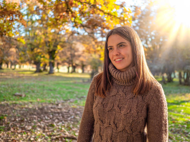 istock Pretty young woman in an oak forest at sunset. 1404094675