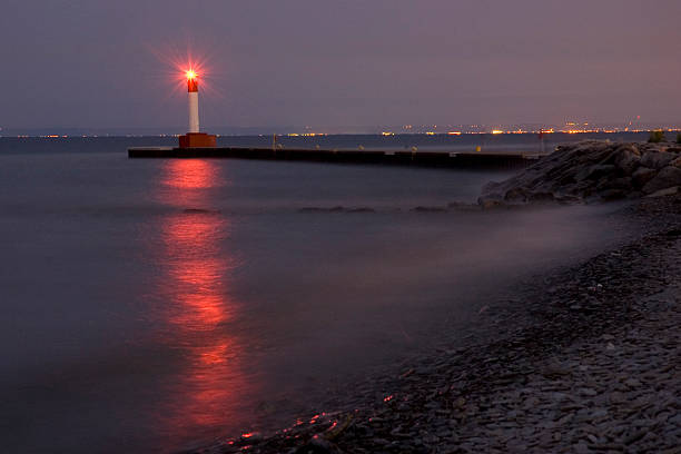 lighthouse reflection lighthouse lighthouse lighting equipment reflection rock stock pictures, royalty-free photos & images