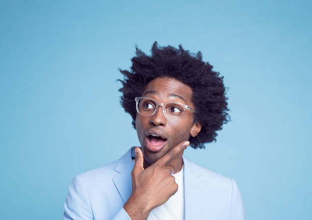 istock Thoughtful businessman with hand on chin 1404096904