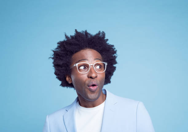 istock Shocked man with Afro hairstyle 1404097687