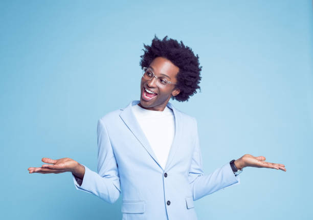 istock Man in blue blazer laughing and gesturing 1404097792