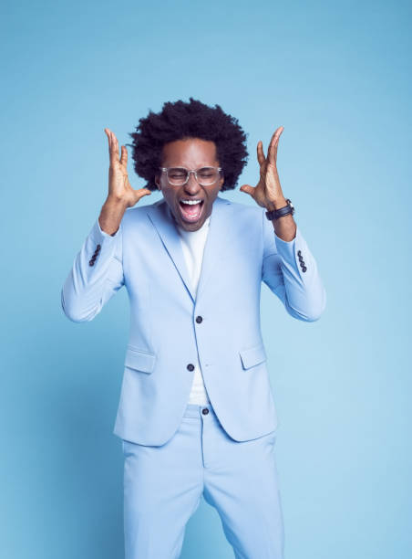istock Man in blue blazer gesturing and screaming 1404097811