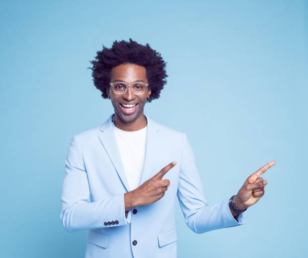 istock Happy man pointing with index fingers 1404097858