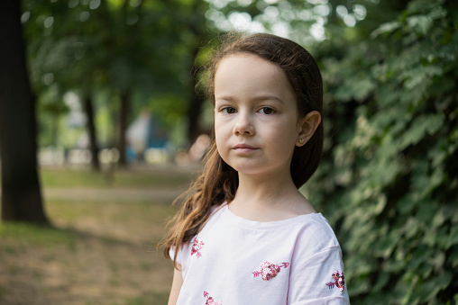 Headshot portrait of little girl posing