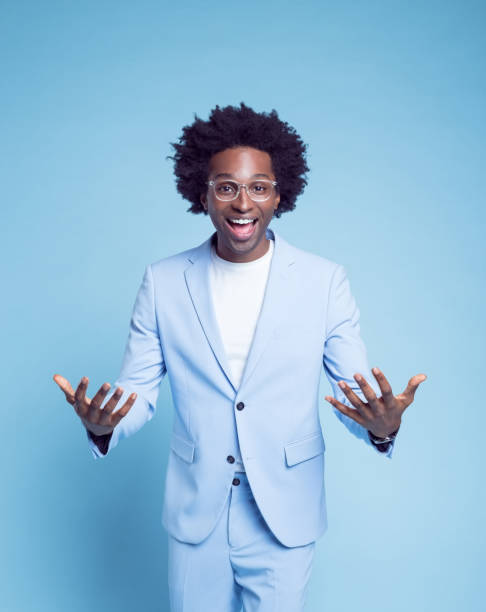 istock Happy businessman gesturing in blue blazer 1404098517
