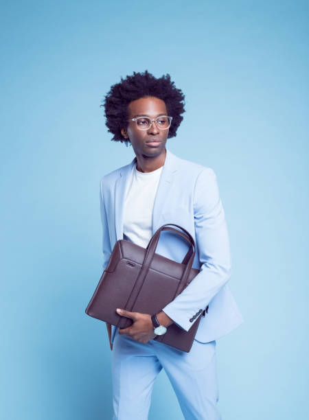 istock Contemplative businessman with briefcase 1404098562