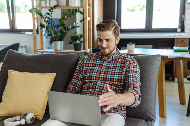 istock Young man surfing the net on the laptop 1404098702