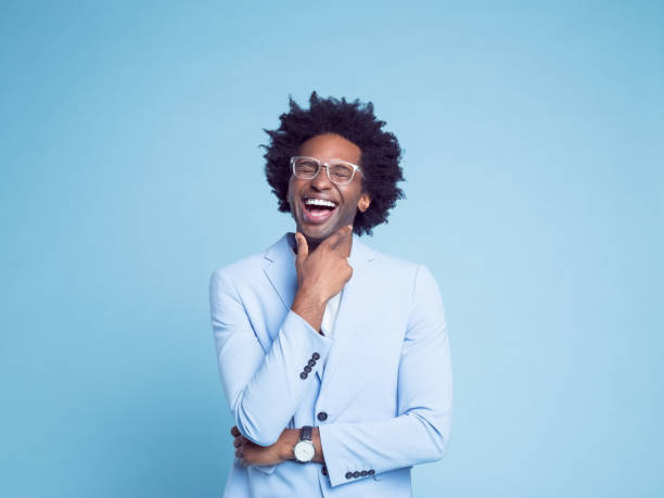 istock Businessman laughing with hand on chin 1404099397
