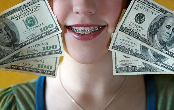 Teen girl with braces - https://media.istockphoto.com/id/140409994/photo/money-for-braces.jpg?s=612x612&w=0&k=20&c=RIDEAG3MC58w7n85WvhFT88emLMstSaiXj60osMdZ6k=