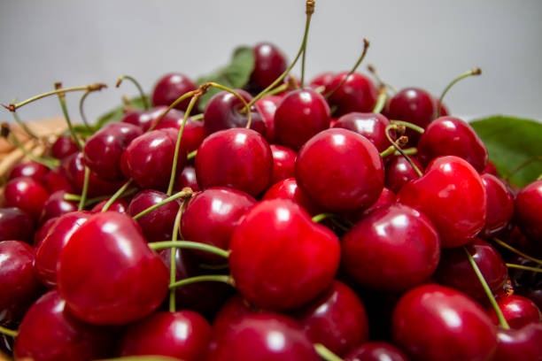 istock Fresh sweet cherries  in woden basket. 1404101108