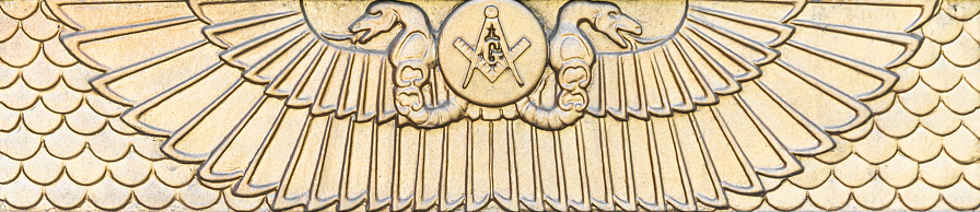 Gold Masonic temple Egyptian symbols with snake heads and wings